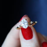 Oval diamond engagement ring with accent diamond stones