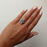 Emerald solitaire with tapered baguettes