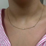 bezel set lab diamond necklace in yellow gold by Deltora Diamonds and CEO Melissa-trafford Jones