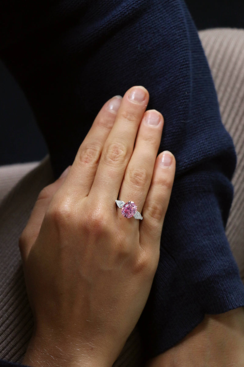 Deltora Diamonds Pink Oval Sapphire with Pear Side Stones Engagement Ring.