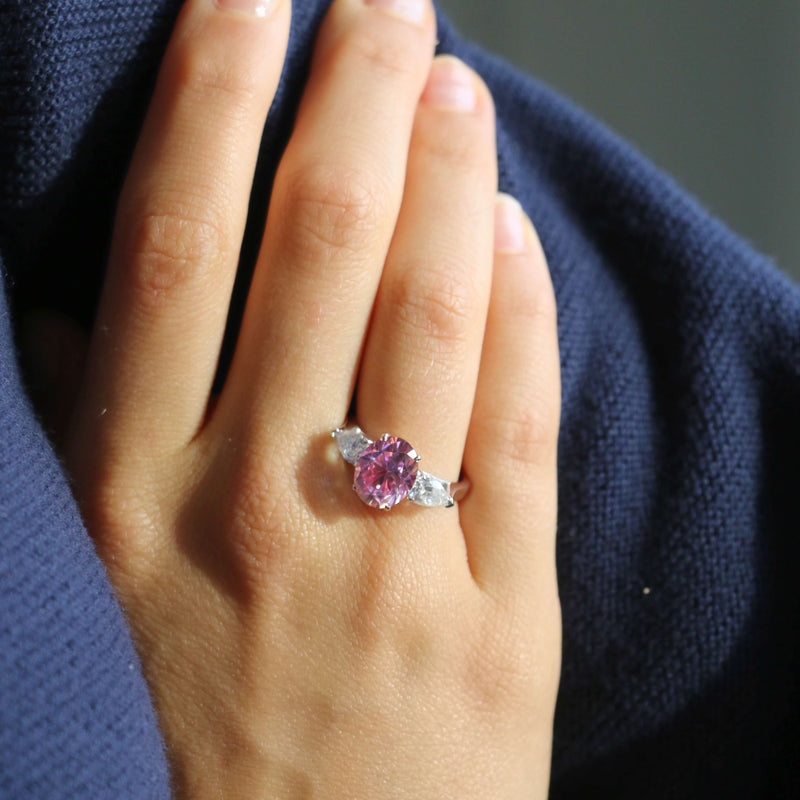 Deltora Diamonds Pink Oval Sapphire with Pear Side Stones Engagement Ring.